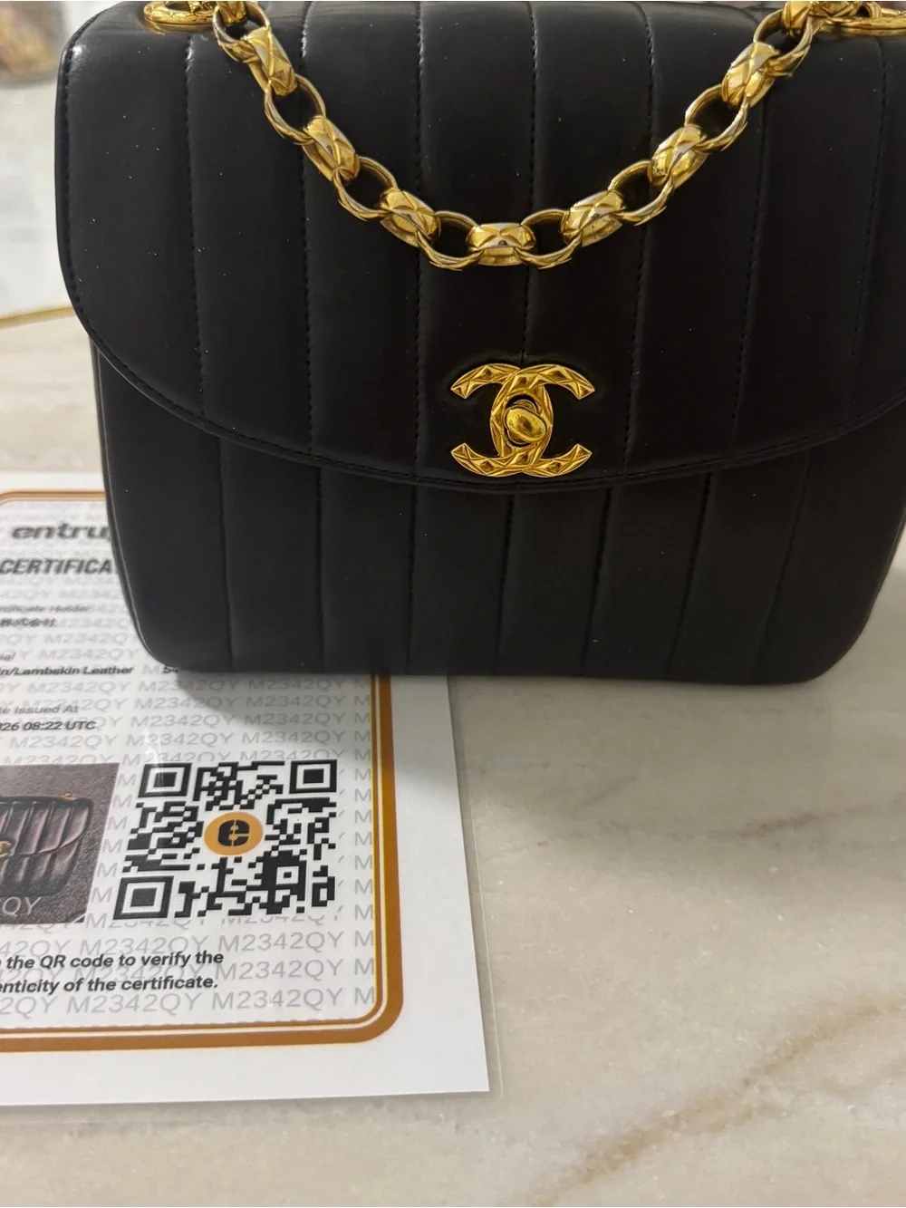 CHANEL Black Vertical Quilted Lambskin Shoulder Bag with Gold Hardware